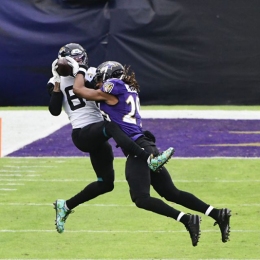 Dec 20, 2020; Baltimore, Maryland, USA;  Jacksonville Jaguars wide receiver Keelan Cole Sr. (84) catches a pass as Baltimore Ravens cornerback Tramon Williams (29) defends during the third quarter at M&T Bank Stadium. Mandatory Credit: Tommy Gilligan-USA TODAY Sports